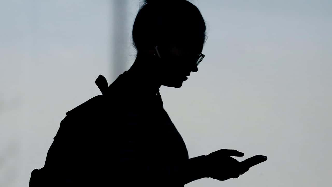 Photo of a woman checking her phone