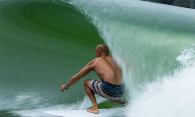 Photo of a man surfing at a wave park in Lemoore, California