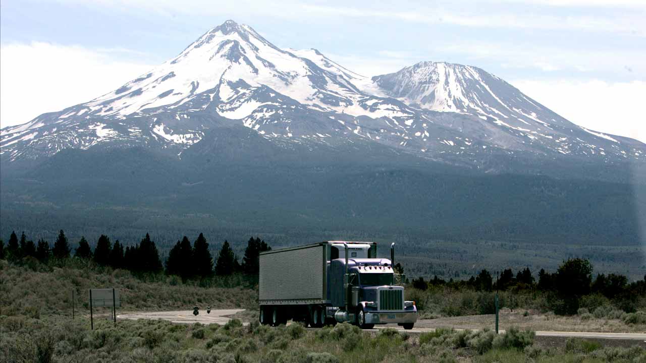 Photo of a big-rig on the road near Mount Shasta