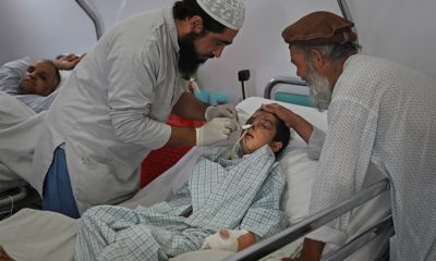 Photo of a paramedic tending to Nesser Ahmad