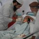 Photo of a paramedic tending to Nesser Ahmad