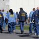 Photo of CDCR prisoners walking through the yard