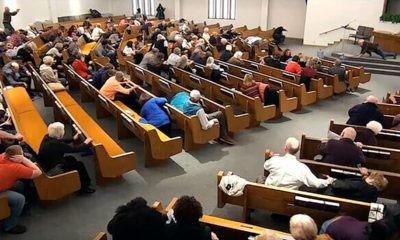 Photo of churchgoers taking cover