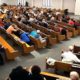 Photo of churchgoers taking cover