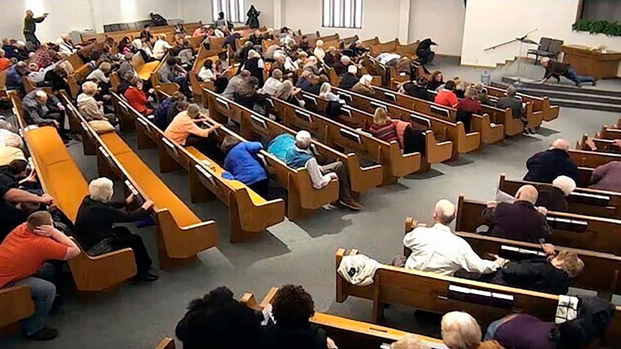 Photo of churchgoers taking cover