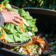 Photo of a person throwing food away