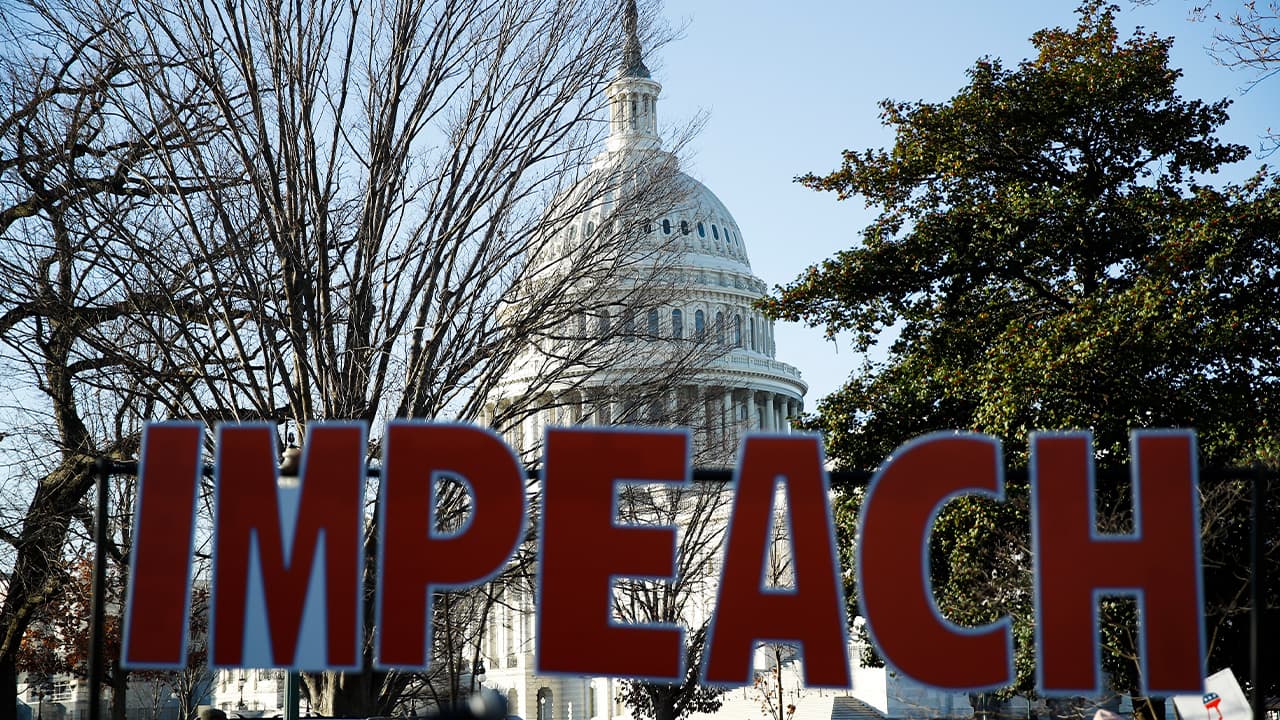 Photo of an IMPEACH sign