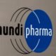 Photo of a sign at the Mundipharma International headquarters at Cambridge Science Park in England