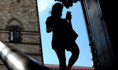 Photo of a woman looking at her phone