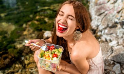 Photo of a woman eating a salad