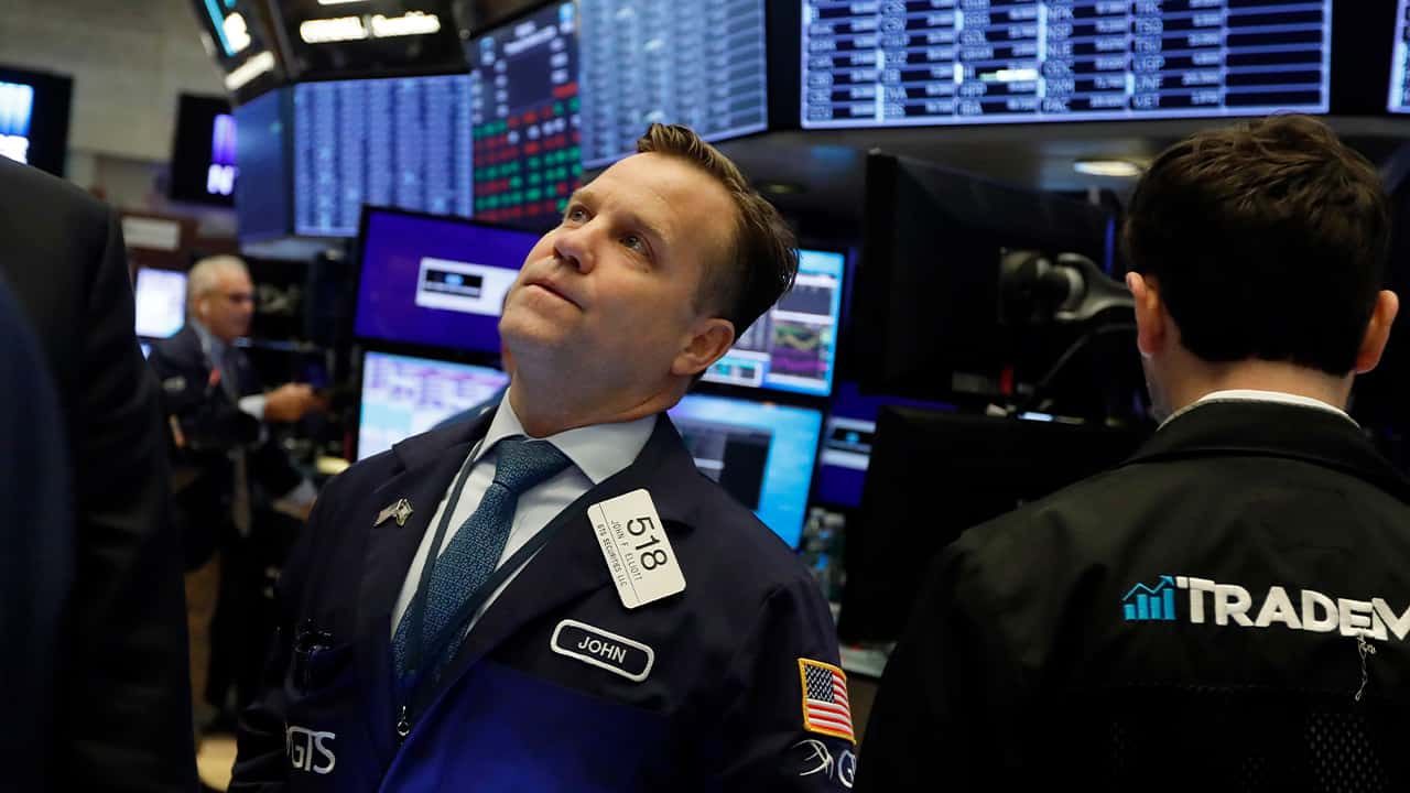 Photo of a trader on the floor of the New York Stock Exchange