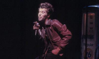 Photo of Tom Waits singing