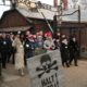 Poland's President Andrzej Duda walking along with survivors through the gates of the Auschwitz Nazi concentration camp to attend the 75th anniversary of its liberation