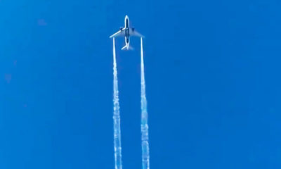 Photo of a plane flying in the sky
