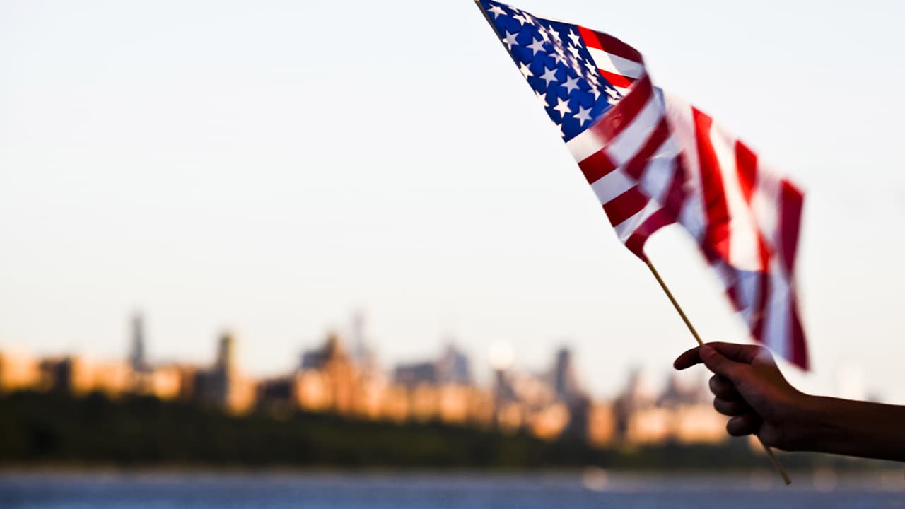 Photo of a person holding an American flag