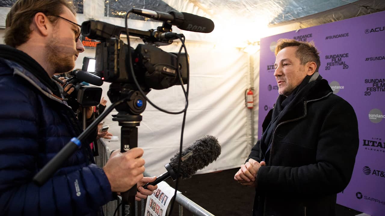 Photo of director/producer Bryan Fogel speaking to reporters