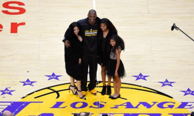 Photo of Los Angeles Lakers' Kobe Bryant poses for pictures with his wife Vanessa, left, and daughters Natalia, second from right, and Gianna