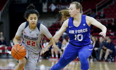 Photo of Bulldogs captain Aly Gamez dibbling past Air Force's Kamri Heath