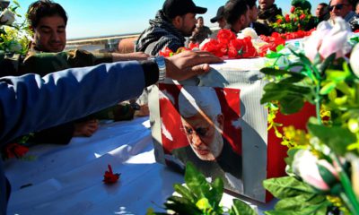 Photo of mourners escorting the flag-draped coffin of Abu Mahdi al-Muhandis, deputy commander of Iran-backed militias