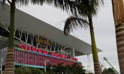 Photo of workers stringing wire outside of the Hard Rock Stadium in Miami Gardens