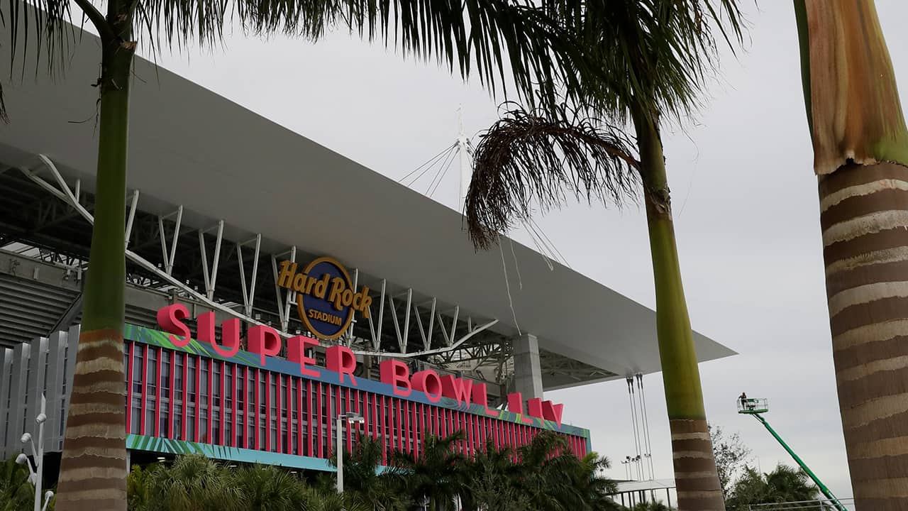 Photo of workers stringing wire outside of the Hard Rock Stadium in Miami Gardens