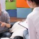 Photo of a young boy talking to a psychologist