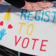 Photo of a Register to Vote sign