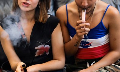 Photo of two women vaping at a party in Los Angeles
