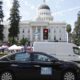 Photo of a car with banners supporting AB 5, the California law reclassifying independent contractors