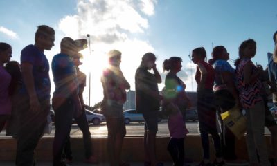 Photo of asylum seekers waiting in line