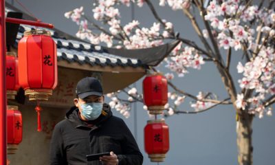 Photo of a man wearing a mask in Beijing, China