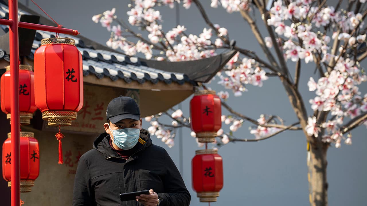 Photo of a man wearing a mask in Beijing, China