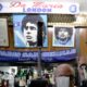 Photo of a bar tender preparing an espresso coffee inside the Bar Nilo where a makeshift shrine of soccer legend and former Napoli player Diego Armando Maradona is displayed