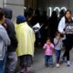 Photo of people outside a U.S. immigration office with numerous courtrooms in San Francisco