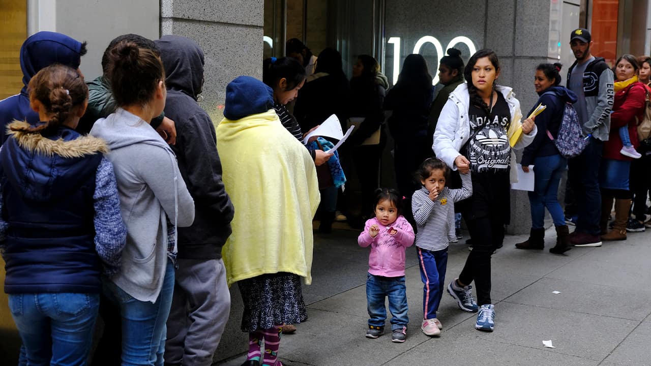 Photo of people outside a U.S. immigration office with numerous courtrooms in San Francisco