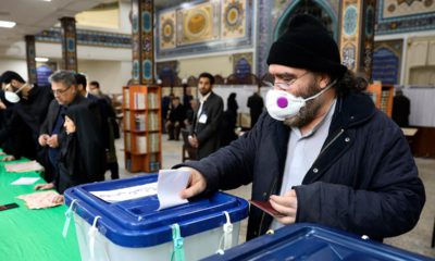 Photo of a voter casting his ballot in Iran