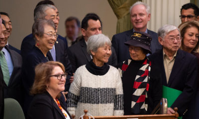 Photo of Japanese Americans who were incarcerated during World War II after the California Assembly passed House Resolution 77