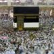 Photo of Muslim pilgrams walking around the Kabaa