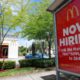Photo of a Now Hiring sign in front of a McDonald's in Miami