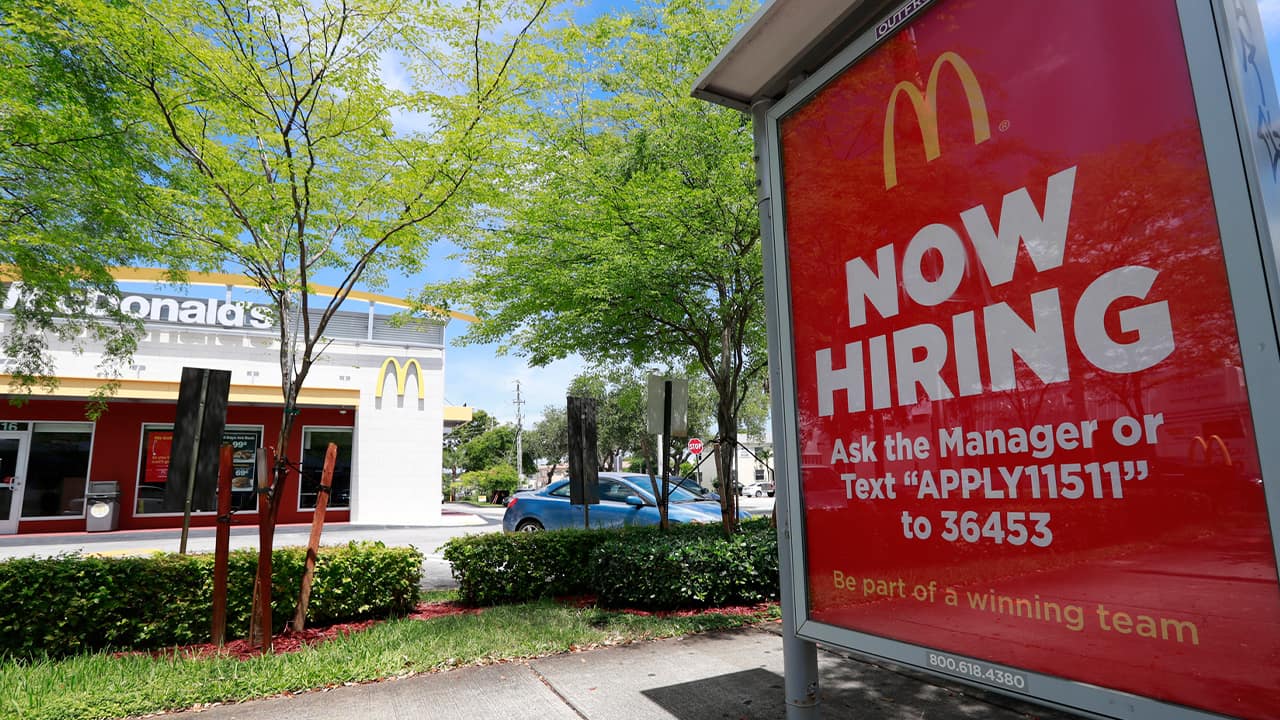 Photo of a Now Hiring sign in front of a McDonald's in Miami