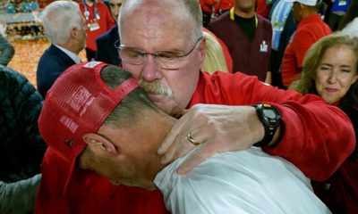 Photo of Kansas City Chiefs head coach Andy Reid, rear, putting his arm around San Francisco 49ers head coach Kyle Shanahan