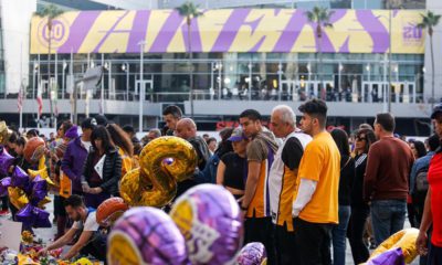 Photo of fans gathering to pay their respects in front of the Staples Center