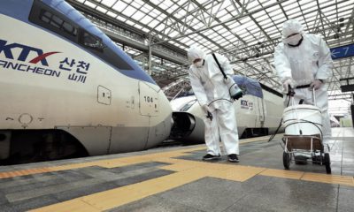 Photo of workers disinfecting the Seoul Railway Station in South Korea