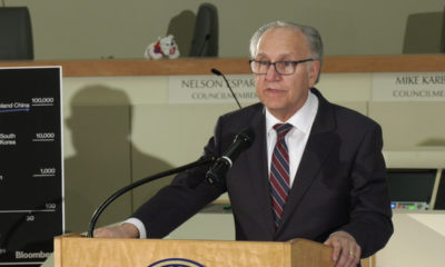 Photo of Fresno Mayor Lee Brand speaking inside City Hall at a podium