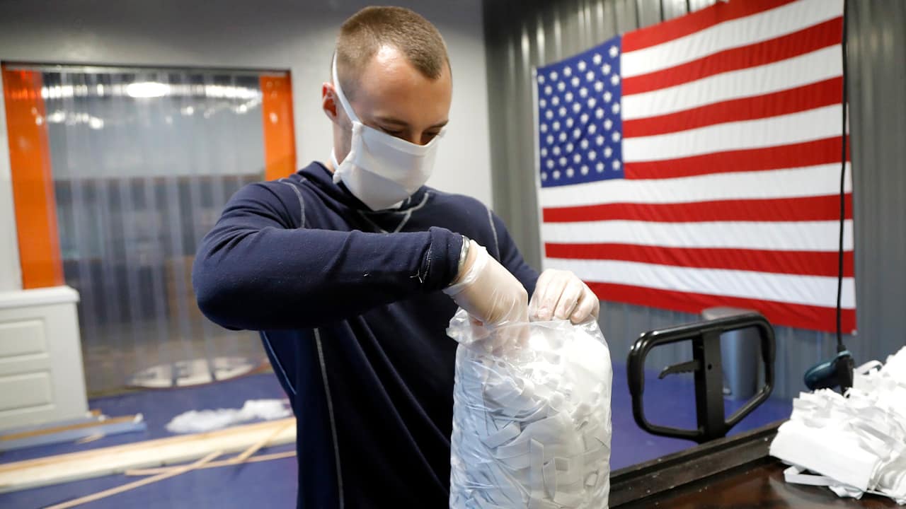 Photo of A.J. Davidson packing face masks