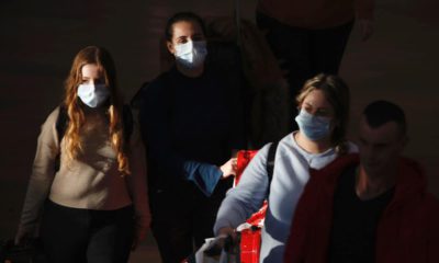 Photo of travelers wearing masks in Tel Aviv, Israel