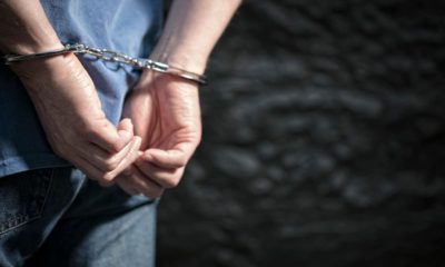 Photo of a arrested man in handcuffs