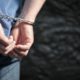 Photo of a arrested man in handcuffs