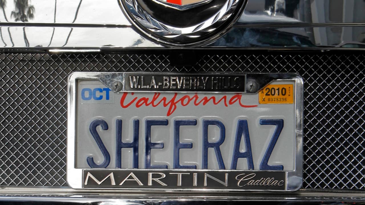 Photo of an SUV with a personalized license plate