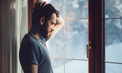 Photo of a man staring out the window